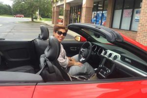 Alba Contreras Rodriguez in a red car